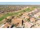 Aerial view featuring a charming home with desert landscaping in a golf course community in a well-maintained residential area at 5812 S Staghorn Cholla Ct, Gold Canyon, AZ 85118