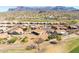 Real estate showcasing a desert landscaped home in a golf course community with breathtaking mountain views in the background at 5812 S Staghorn Cholla Ct, Gold Canyon, AZ 85118