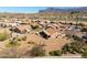Single-story home with desert landscaping in a community featuring well-maintained lawns, cacti, and mountain views at 5812 S Staghorn Cholla Ct, Gold Canyon, AZ 85118