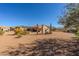 Large backyard featuring desert landscaping with cacti and mountain views at 5812 S Staghorn Cholla Ct, Gold Canyon, AZ 85118