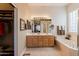 Bright bathroom featuring a double vanity, soaking tub, and a separate walk-in closet at 5812 S Staghorn Cholla Ct, Gold Canyon, AZ 85118