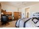 Bright, spacious bedroom featuring a ceiling fan and wooden furniture for ample storage at 5812 S Staghorn Cholla Ct, Gold Canyon, AZ 85118