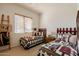Bright bedroom features two twin beds with decorative quilts and matching red decorative headboards at 5812 S Staghorn Cholla Ct, Gold Canyon, AZ 85118