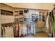 Well-organized walk-in closet with ample shelving and rods for efficient storage solutions at 5812 S Staghorn Cholla Ct, Gold Canyon, AZ 85118