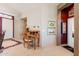 Inviting entryway with a charming desk, elegant artwork, and a view of the front door and the bedroom hallway at 5812 S Staghorn Cholla Ct, Gold Canyon, AZ 85118