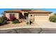 Charming single-story home with a tile roof and well-manicured desert landscaping for a warm and inviting curb appeal at 5812 S Staghorn Cholla Ct, Gold Canyon, AZ 85118