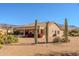 Beautiful home exterior, showcasing desert landscaping and mountain views at 5812 S Staghorn Cholla Ct, Gold Canyon, AZ 85118