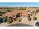 Attractive single-story home features well-maintained landscaping, a tile roof, and a two-car garage in a golf community at 5812 S Staghorn Cholla Ct, Gold Canyon, AZ 85118