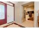 Inviting foyer with a decorative rug, stylish decor, and a window for natural light at 5812 S Staghorn Cholla Ct, Gold Canyon, AZ 85118