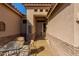Close-up of front patio with outdoor seating and decorative details, enhancing curb appeal at 5812 S Staghorn Cholla Ct, Gold Canyon, AZ 85118
