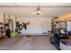 A spacious garage with storage and a golf cart at 5812 S Staghorn Cholla Ct, Gold Canyon, AZ 85118