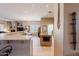 Open kitchen with bar seating, stainless appliances, and a seamless flow to the living spaces at 5812 S Staghorn Cholla Ct, Gold Canyon, AZ 85118
