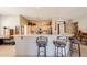 Open kitchen featuring a breakfast bar, maple cabinets, and stainless steel appliances at 5812 S Staghorn Cholla Ct, Gold Canyon, AZ 85118