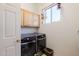 A laundry room featuring modern washer and dryer units at 5812 S Staghorn Cholla Ct, Gold Canyon, AZ 85118