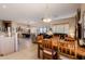 Open-concept living space with dining area, kitchen bar, and fireplace at 5812 S Staghorn Cholla Ct, Gold Canyon, AZ 85118