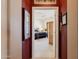 Open doorway revealing a serene main bedroom with a king bed, a ceiling fan, and neutral decor at 5812 S Staghorn Cholla Ct, Gold Canyon, AZ 85118