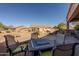 Outdoor patio with a built-in kitchen, pizza oven, and comfortable seating for entertaining at 5812 S Staghorn Cholla Ct, Gold Canyon, AZ 85118