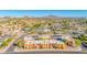 A beautiful aerial view of the apartment complex with surrounding neighborhoods and desert mountains in the background at 604 E Weber Dr # 12, Tempe, AZ 85288