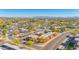 A lovely aerial view of the property and neighborhood, highlighting covered parking and mountain views in the distance at 604 E Weber Dr # 12, Tempe, AZ 85288