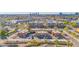 Aerial view of condos and a complex with a pool area, highlighting the community and ample parking at 604 E Weber Dr # 12, Tempe, AZ 85288
