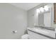 Bathroom featuring sleek white vanity and modern mirror with decorative lighting at 604 E Weber Dr # 12, Tempe, AZ 85288