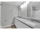 Bright bathroom featuring double vanity, granite countertops, and tub-shower combo at 604 E Weber Dr # 12, Tempe, AZ 85288