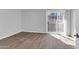 Neutral bedroom with new flooring and a sliding glass door to a balcony at 604 E Weber Dr # 12, Tempe, AZ 85288