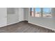 Bedroom showcasing a new paint job, durable floors, and three large windows at 604 E Weber Dr # 12, Tempe, AZ 85288