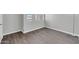 Bedroom showing new paint, flooring, and three large windows at 604 E Weber Dr # 12, Tempe, AZ 85288