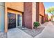 Exterior view of the front entrance featuring a secure black iron gate and a desert landscape at 604 E Weber Dr # 12, Tempe, AZ 85288