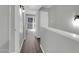Hallway with new flooring and a view to the outside through a window at 604 E Weber Dr # 12, Tempe, AZ 85288