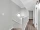 A bright stairway and hallway with hardwood floors and light walls at 604 E Weber Dr # 12, Tempe, AZ 85288