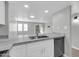 Modern kitchen with white cabinets, granite countertops, and stainless steel appliances at 604 E Weber Dr # 12, Tempe, AZ 85288