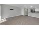 Spacious living room with tile floors and neutral paint, transitioning to the kitchen at 604 E Weber Dr # 12, Tempe, AZ 85288