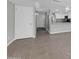Bright living room with tile floors flowing into a kitchen area with stainless steel appliances at 604 E Weber Dr # 12, Tempe, AZ 85288