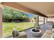 Covered patio and spacious backyard featuring a built-in grill and an outdoor dining area at 6204 S Banning St, Gilbert, AZ 85298