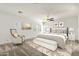 Serene bedroom with neutral tones, plush carpet, bench, and a relaxing atmosphere at 6204 S Banning St, Gilbert, AZ 85298