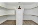 Walk-in closet with open shelving offers ample storage space at 6204 S Banning St, Gilbert, AZ 85298
