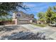 Spacious home with attached garage, landscaping, and a large driveway at 6204 S Banning St, Gilbert, AZ 85298