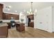 Open concept kitchen with center island, stainless appliances, and view of breakfast nook at 6204 S Banning St, Gilbert, AZ 85298