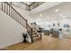Open living area featuring staircase, wood floors, recessed lighting, and elegant furniture at 6204 S Banning St, Gilbert, AZ 85298