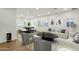 Bright open living space with stylish furnishings, modern artwork, and a dining area beyond at 6204 S Banning St, Gilbert, AZ 85298