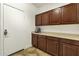 Mud room with plenty of storage and counter space next to exterior door at 6204 S Banning St, Gilbert, AZ 85298