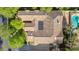 Stunning aerial view of a tile-roofed home with a sparkling pool and lush landscaping at 8336 S Homestead Ln, Tempe, AZ 85284