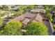 Aerial view of a home with a tile roof surrounded by mature trees at 8336 S Homestead Ln, Tempe, AZ 85284
