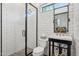 Modern bathroom featuring white subway tile, black fixtures, and glass enclosed shower at 8336 S Homestead Ln, Tempe, AZ 85284