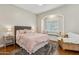 Charming bedroom with an arched window seat, a plush rug, and soft natural light at 8336 S Homestead Ln, Tempe, AZ 85284