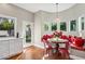 Cozy breakfast nook with a window seat, charming chandelier, and natural light at 8336 S Homestead Ln, Tempe, AZ 85284