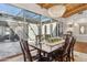 Elegant dining room with wood table, chairs, chandelier, and access to a bright outdoor patio at 8336 S Homestead Ln, Tempe, AZ 85284