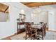 Dining room showcasing wood floors, custom lighting, and access to the outdoor courtyard at 8336 S Homestead Ln, Tempe, AZ 85284